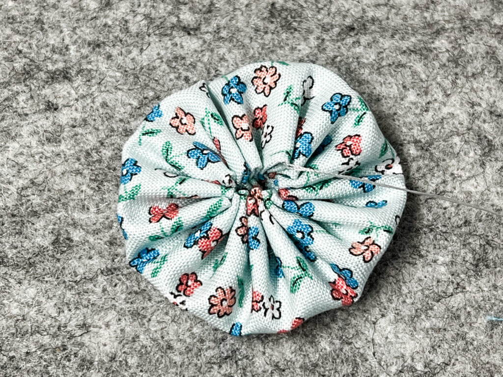 A fully gathered yo-yo in Playtime 30's fabric.