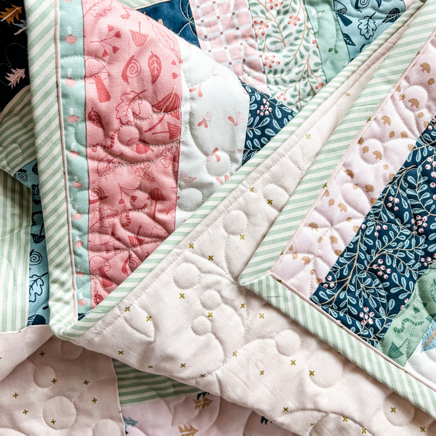 Folk Fables Quilt, throw size, pattern designed by Tamara Darragh for Remi Vail Studio using the Forest Village Fabric Collection designed by Little Forest Atelier for Riley Blake Designs