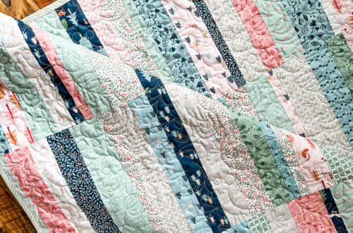 Folk Fables Quilt, throw size, pattern designed by Tamara Darragh for Remi Vail Studio using the Forest Village Fabric Collection designed by Little Forest Atelier for Riley Blake Designs