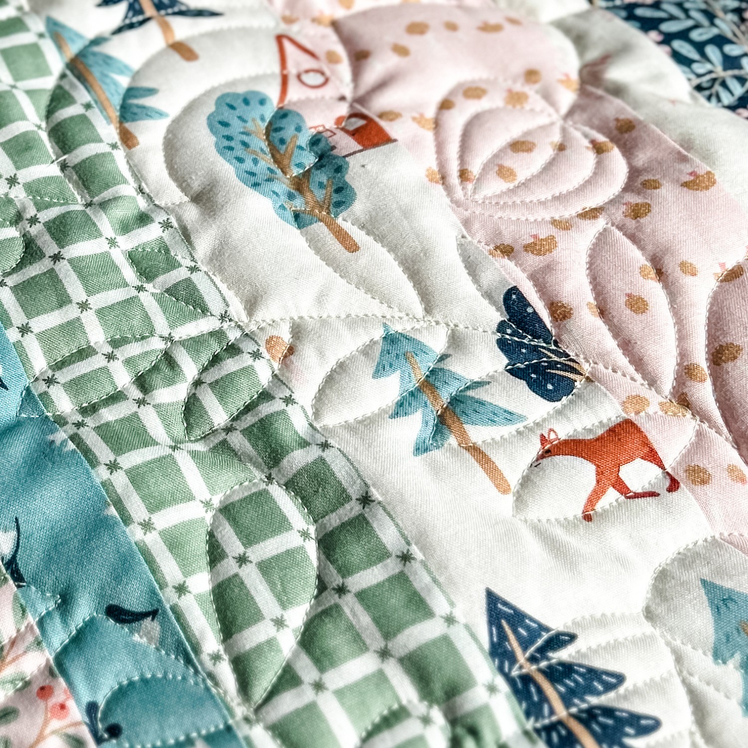 Folk Fables Quilt, throw size, pattern designed by Tamara Darragh for Remi Vail Studio using the Forest Village Fabric Collection designed by Little Forest Atelier for Riley Blake Designs